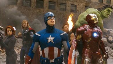 The Avengers team standing together in battle scene
