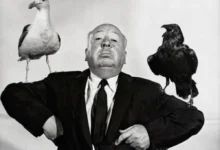 Alfred Hitchcock directing a suspense scene on set.