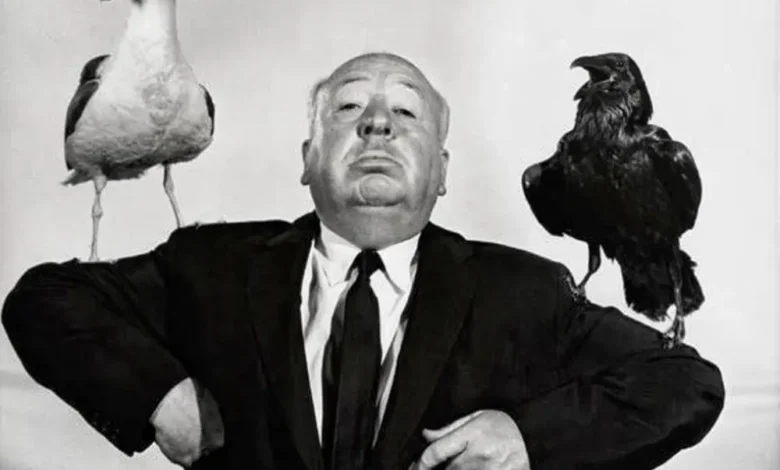 Alfred Hitchcock directing a suspense scene on set.