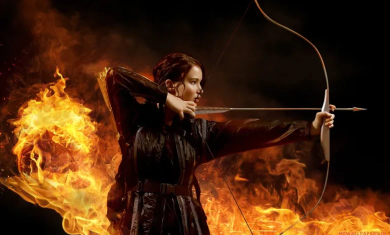 Katniss Everdeen aiming bow in The Hunger Games